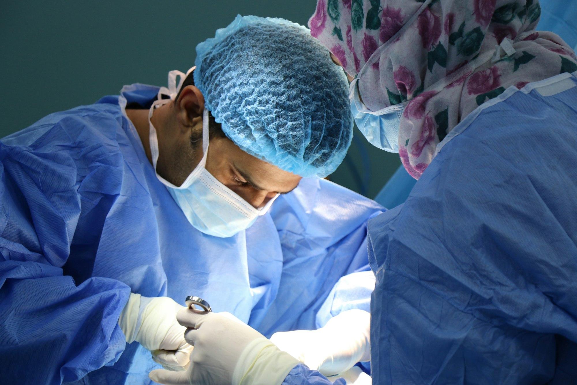 A caregiver holding a patient's hands